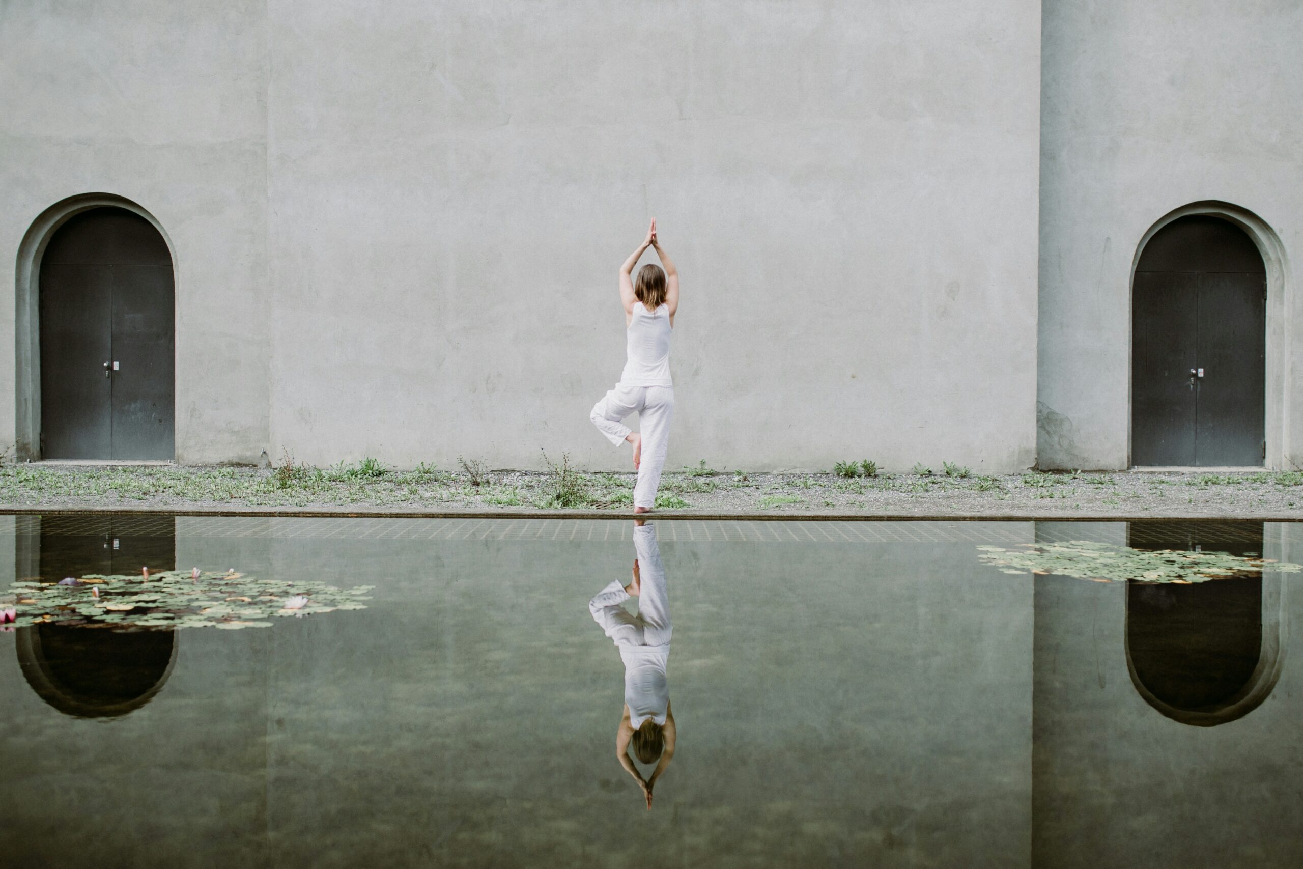 Woman doing a balance yoga pose (Tree)