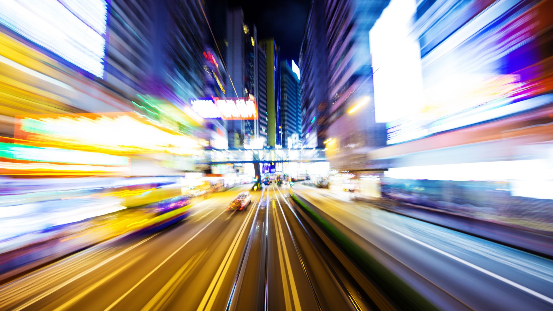 A repivot mindset is required in an AI era. Photo of blurred city lights.