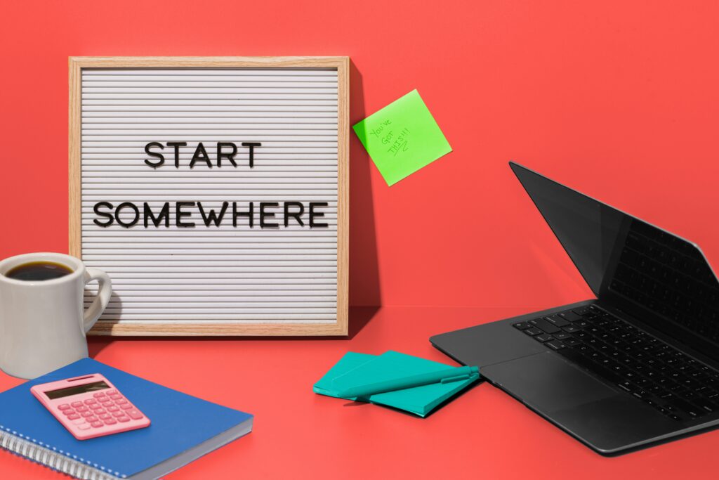 Entrepreneurship is a rapid learning technique - photo with a sign that reads, "Start Somewhere."